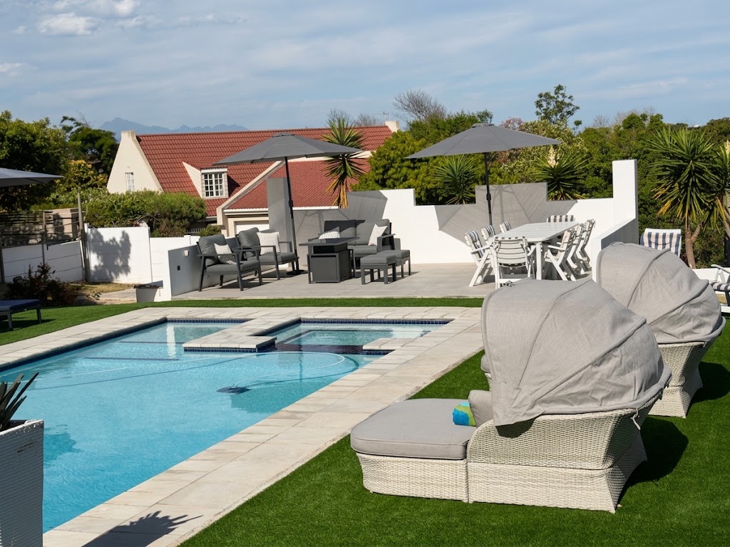 Pool Lounge Area with shaded seating beside the Oasis