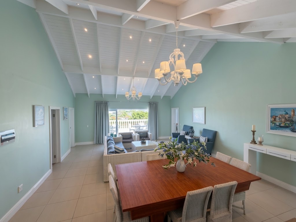 Family Bar Lounge with its dining table, seating area and vaulted ceiling